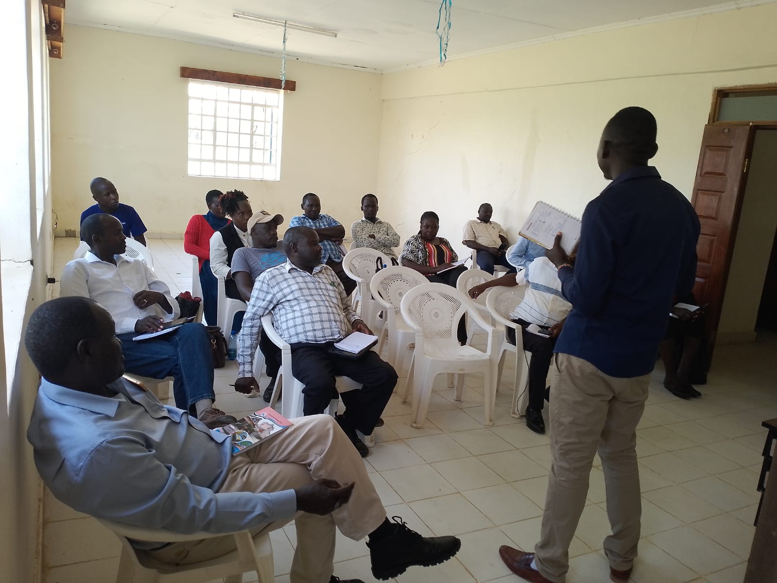 Dr. Walekhwa engaging community participants in a research session